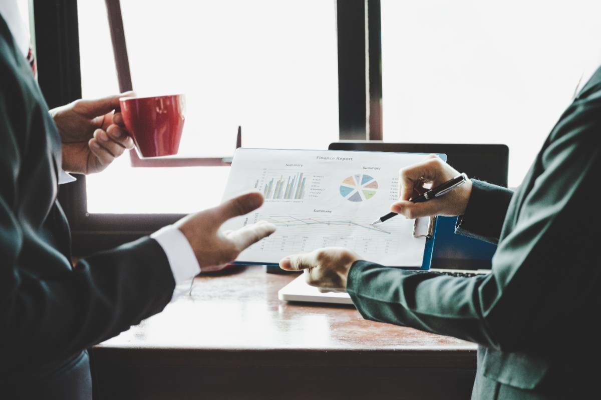 business-team-analyzing-income-charts-graphs (1)